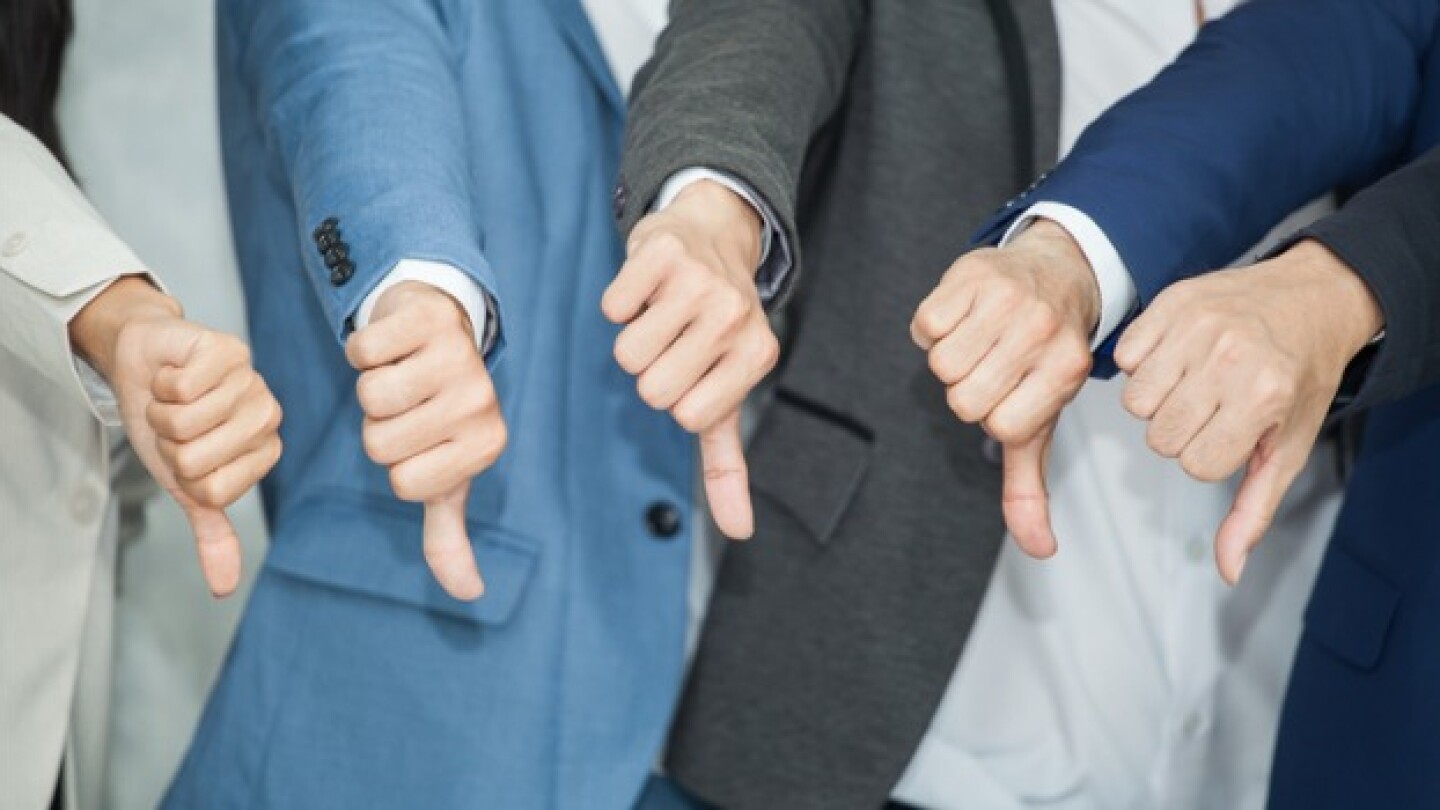 Pictured: People in suits with their thumbs down/i