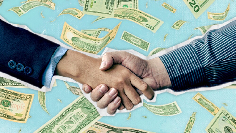 Pictured: Handshake in front of raining money / Ta