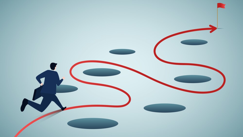 Illustration showing businessman avoiding potholes on way to goal