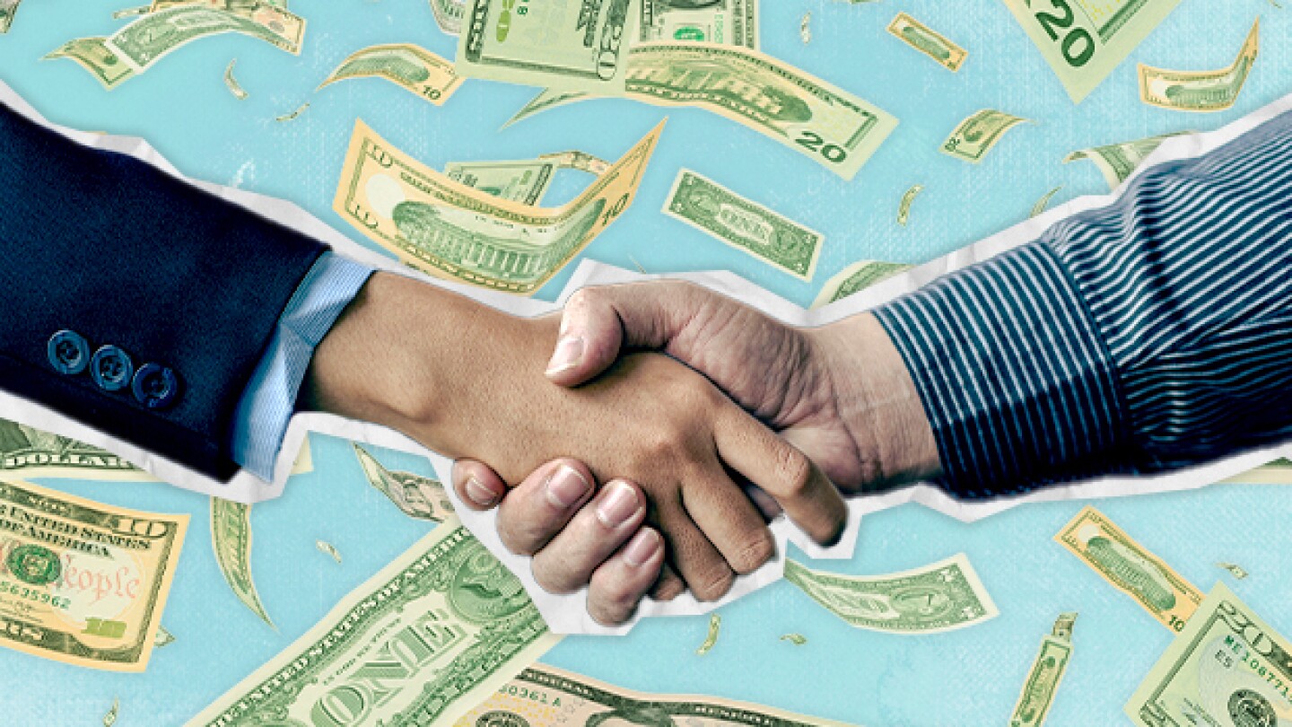 Pictured: Handshake in front of raining money / Ta