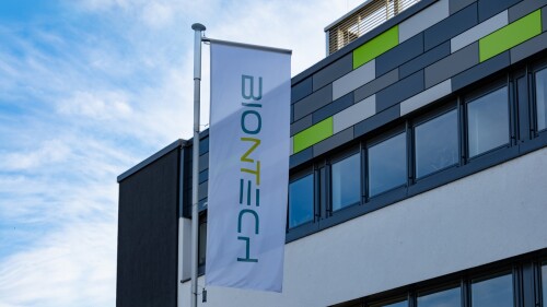 Biontech SE headquarters with company flags, German biotechnology company, BioNTech Manufacturing, development and production active immunotherapeutic agents in Mainz, Germany - September 7, 2024