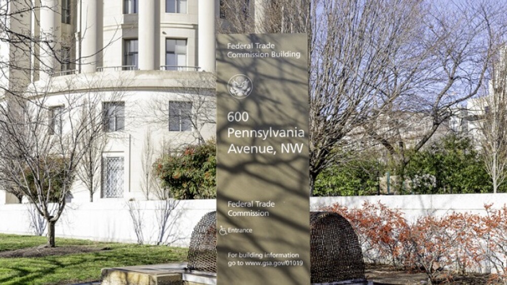 Pictured: A building with a sign out front that re