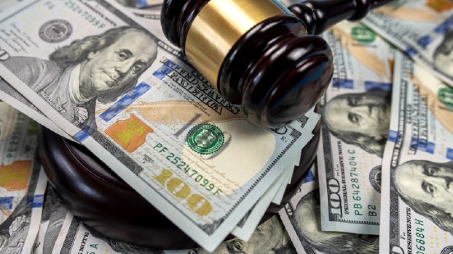 Pictured: Gavel with cash bills/Courtesy iStock, a