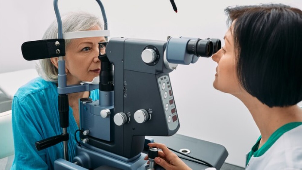 Pictured: Healthcare worker conducting an eye exam
