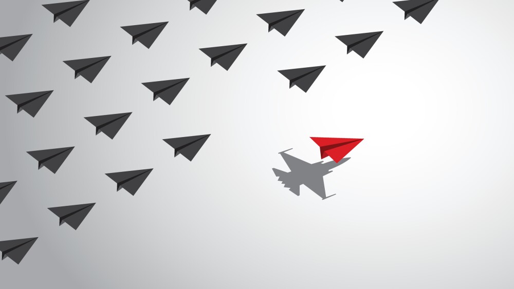 A red paper airplane with a fighter jet shadow changes course from a group of other paper airplanes, a concept of different business and social behaviors. Vector illustration.