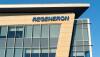 Pictured: Regeneron logo on a light brown building
