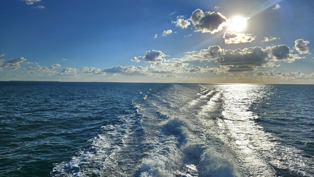 Ocean with the wake of the ferry out to Dry Tortugas National Park in Florida Keys