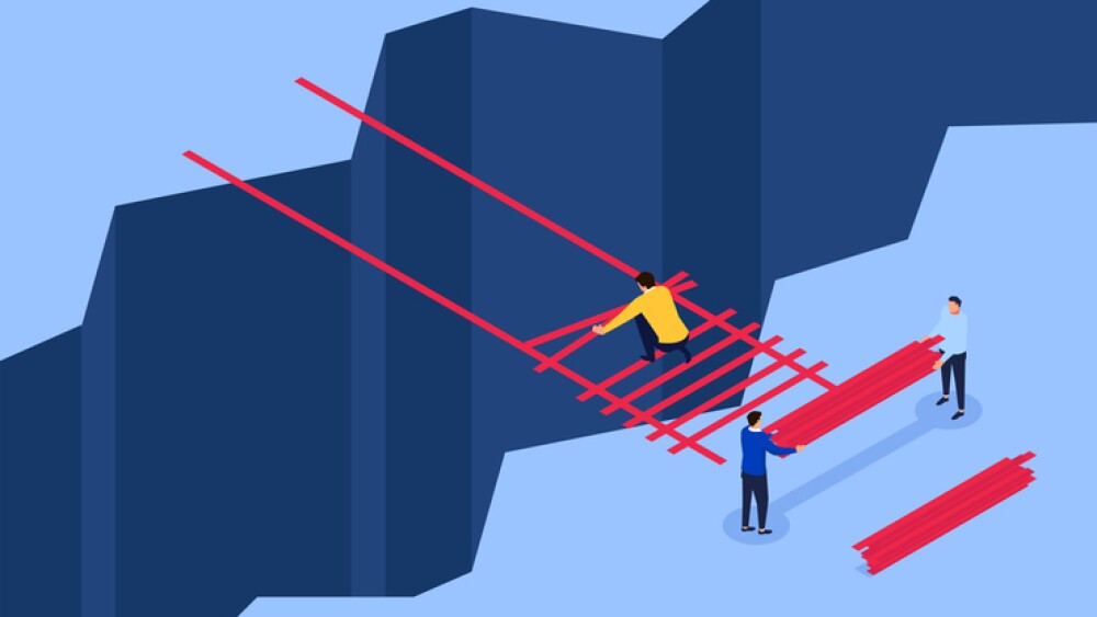 cartoon showing teamwork to build a bridge across a chasm