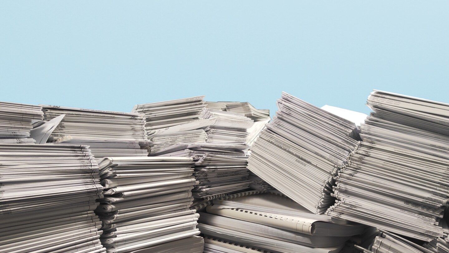 Stack of documents. Pile of waste documents earmarked for Recycling.