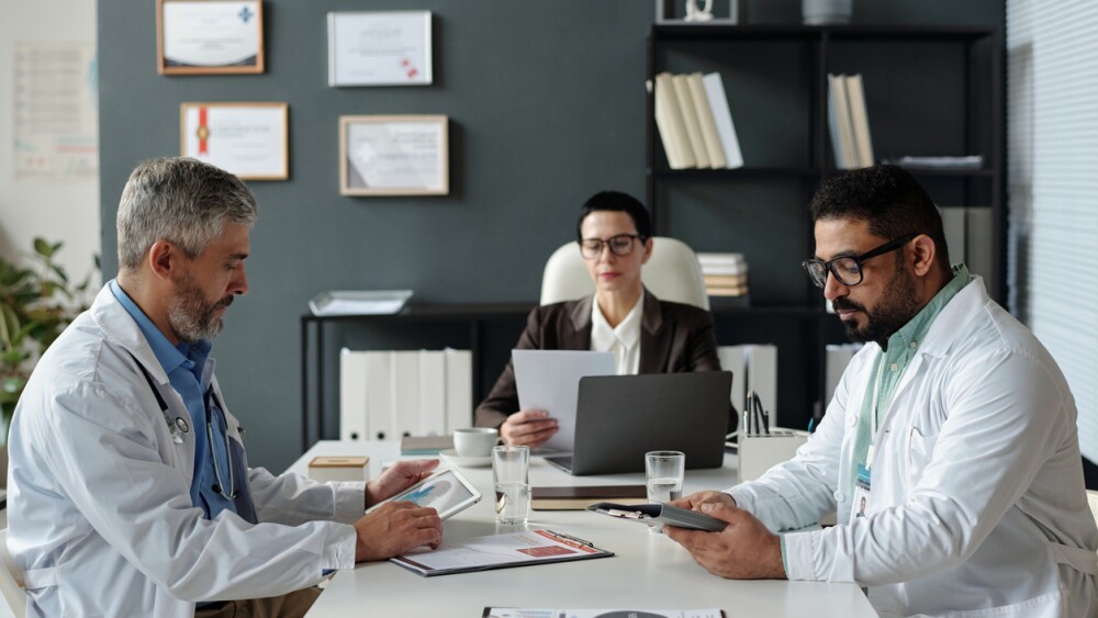 Photo of scientists and legal counsel in meeting
