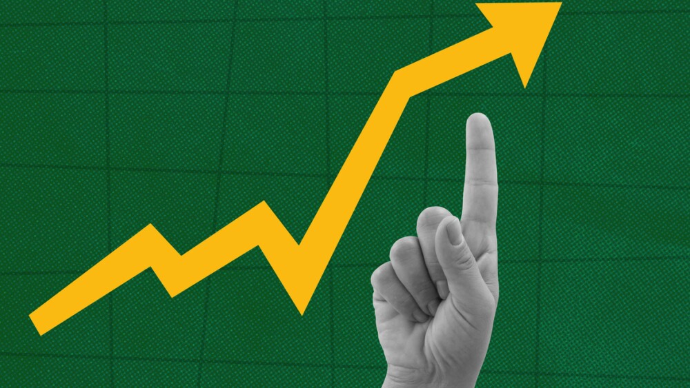 Hand pointing upward with growth arrow. Business success and positive progress.