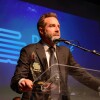 Denali Therapeutic CEO Ryan Watts accepts the Visionary of the Year award at BioHive Live in Salt Lake City, Utah, on April 16, 2026.