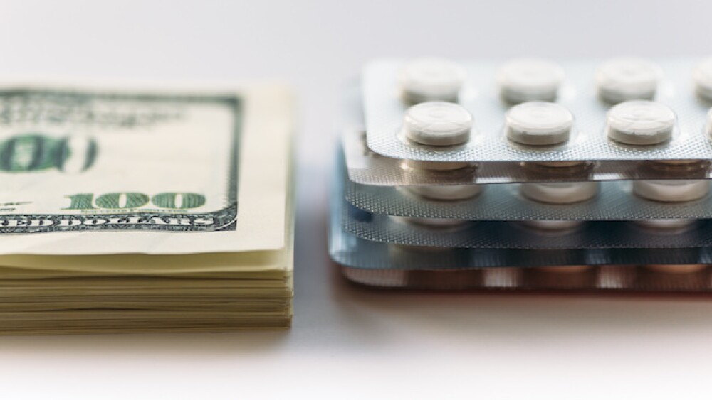 Pictured: Stack of money next to medications/Court