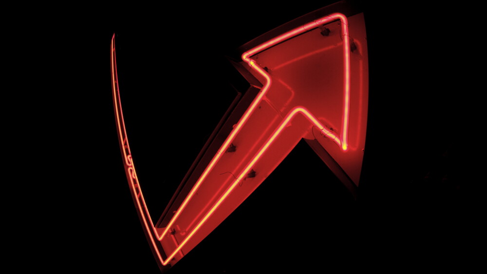 Neon arrow sign showing a jumbo reversal of fortune