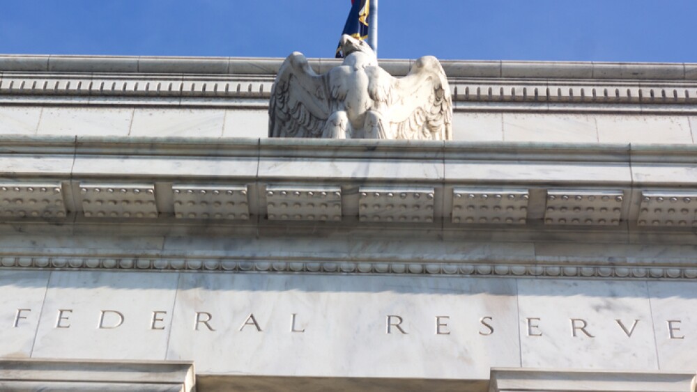 Close up of the Federal Reserve building with the eagle statue.