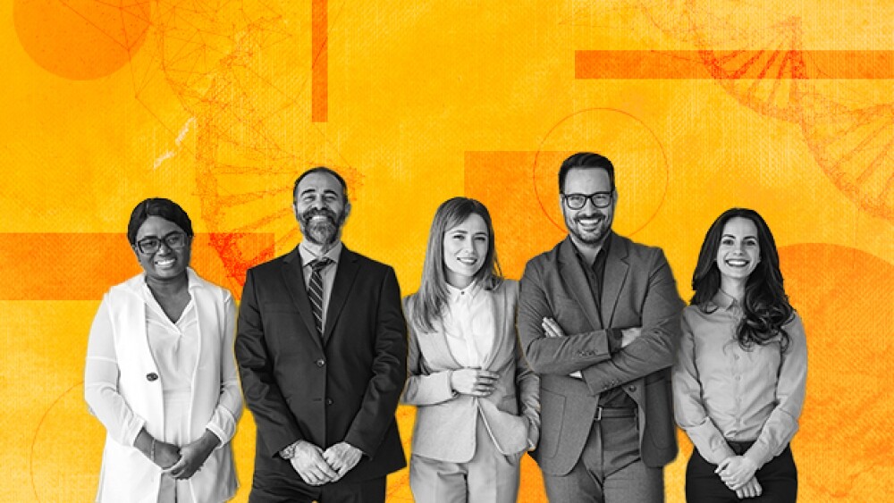Pictured: Smiling Professionals In Front of Abstra