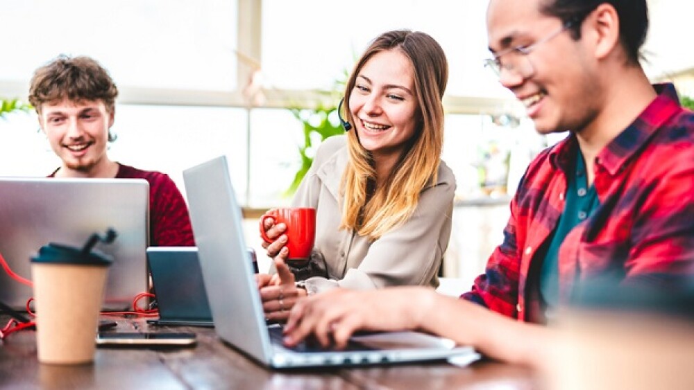 Young people employee coworkers busy at computer in startup studio - Human resource business and teamwork concept on laptop working time - Start up entrepreneurs at coworking