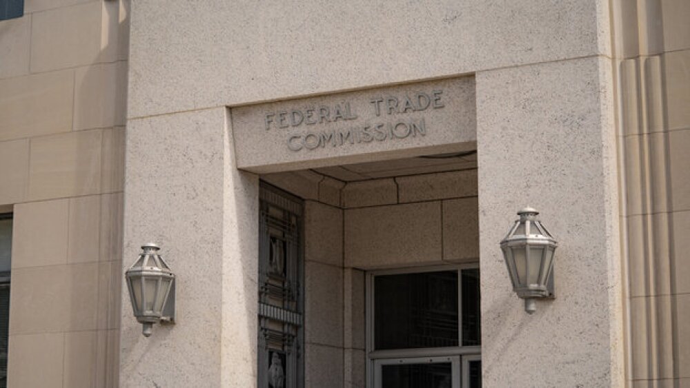 Pictured: FTC sign above a doorway/iStock, Evgenia