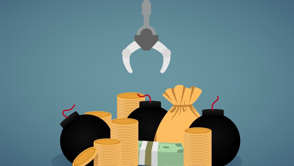 Robotic Claw grab money from a pile of money and bomb.take risk. Grip robotic claw in factory. claw Arcade game put money and coin.claw game device. toy cranes claw machine.