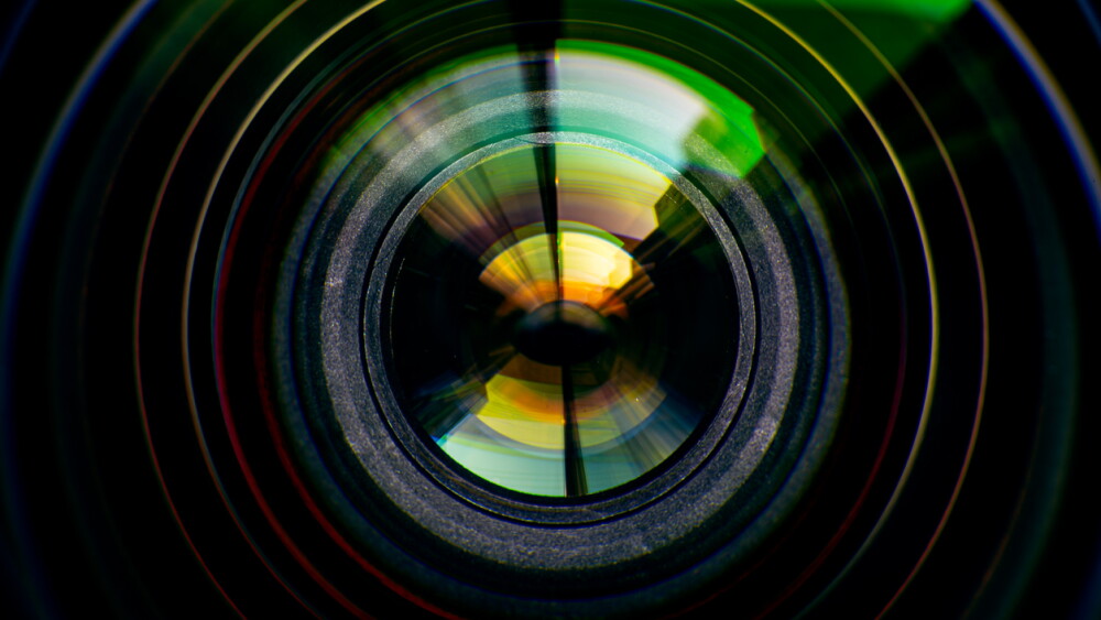 Macro camera lens,Close-up camera lens,Photo Camera or Video lens close-up on black background, objective, concept of photographer camera man job, looking for a photographer,