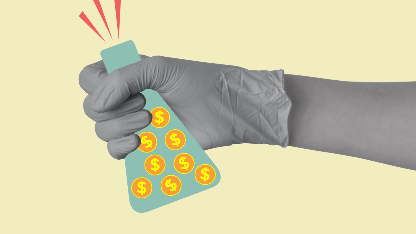 A hand in a medical or laboratory glove holds a laboratory flask with coins with dollar sign. Investments in laboratory research and science. Concept of profit, making money, business. Modern design. Copy space.