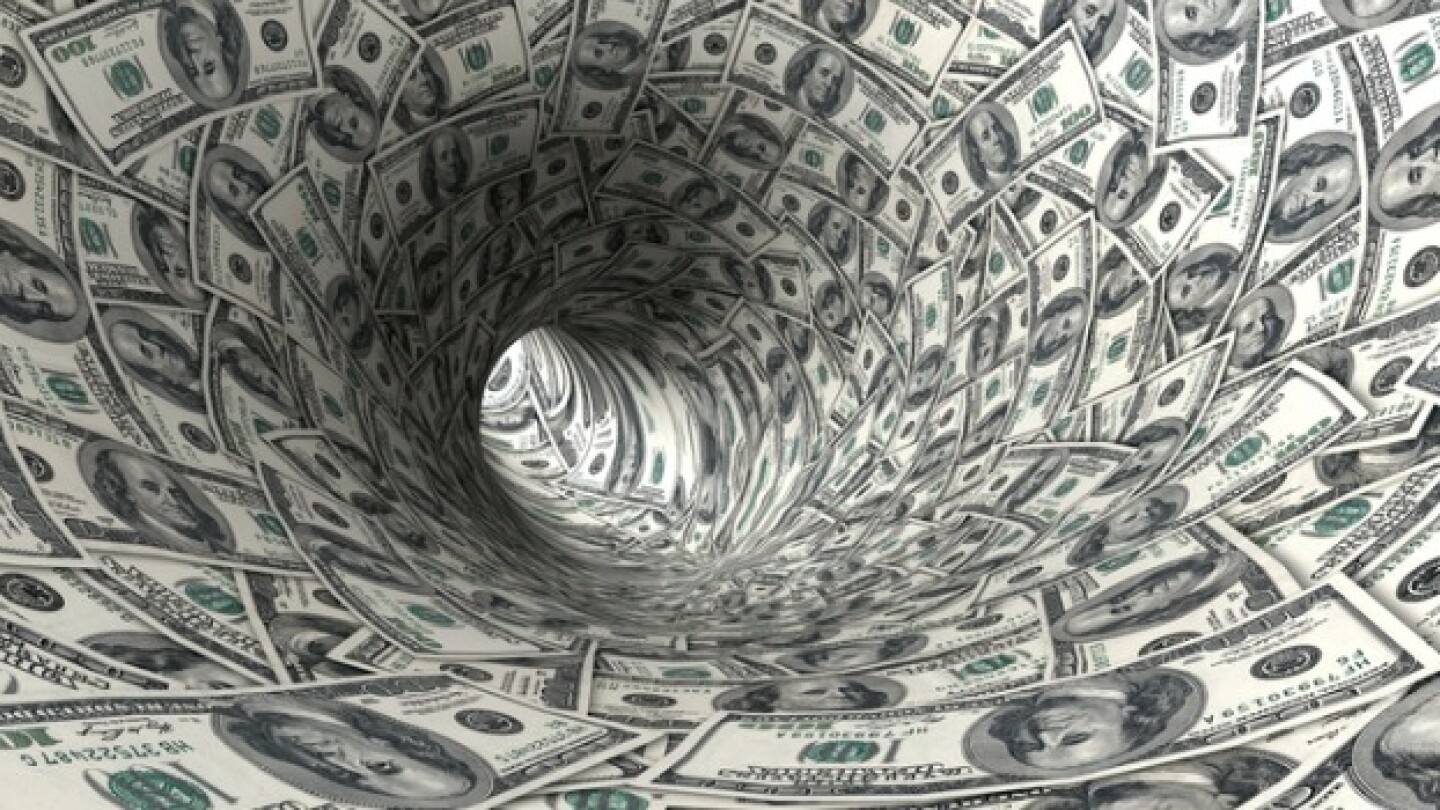 Pictured: American cash shaped into a funnel/iStoc