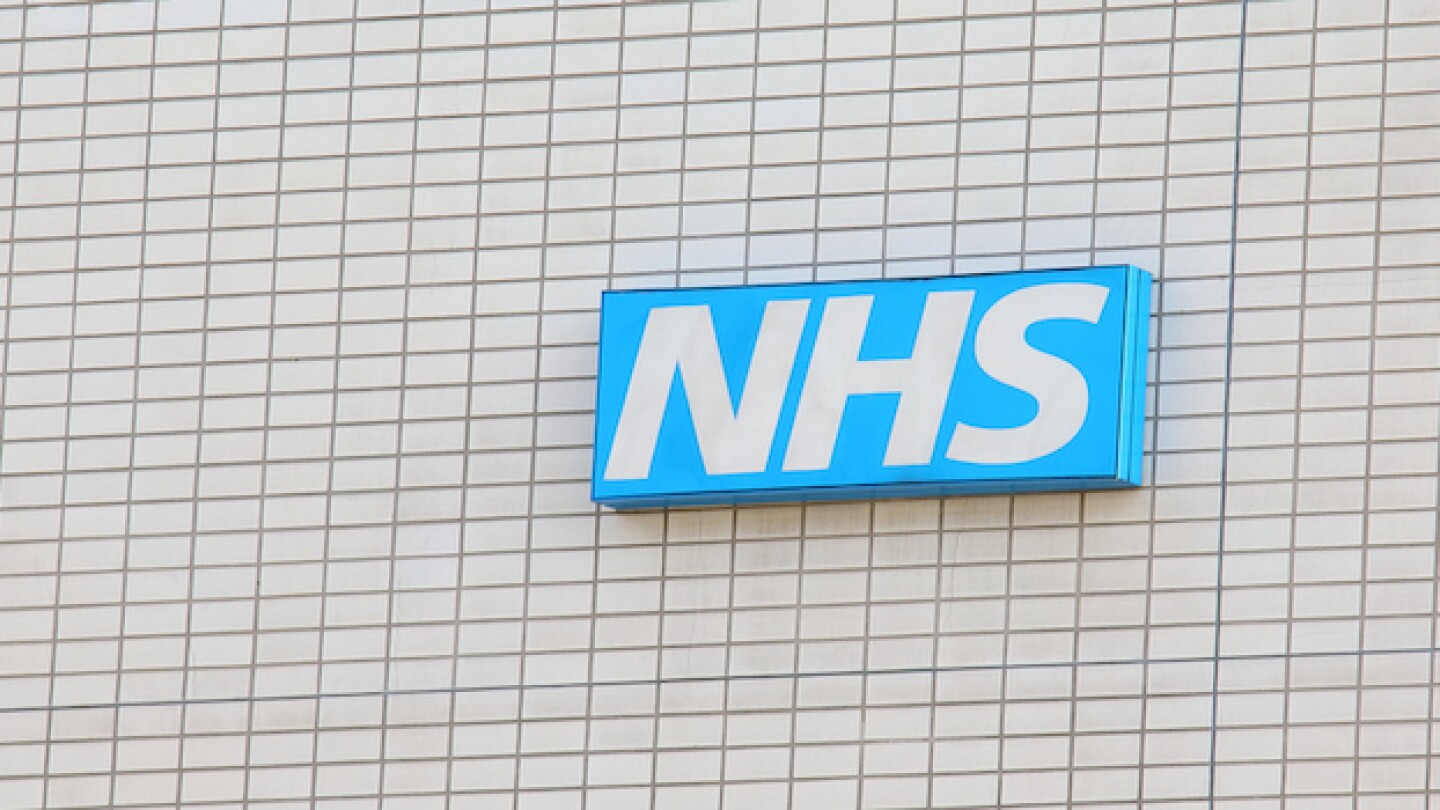 Pictured: NHS sign on a building/iStock, TkKurikaw