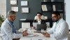 Photo of scientists and legal counsel in meeting