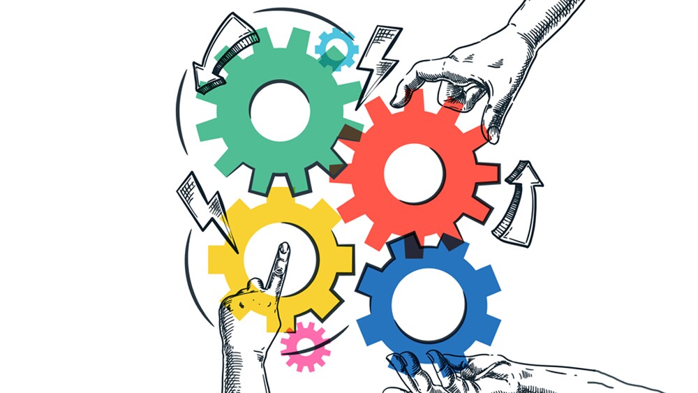 Illustration showing hands connecting mechanism gears