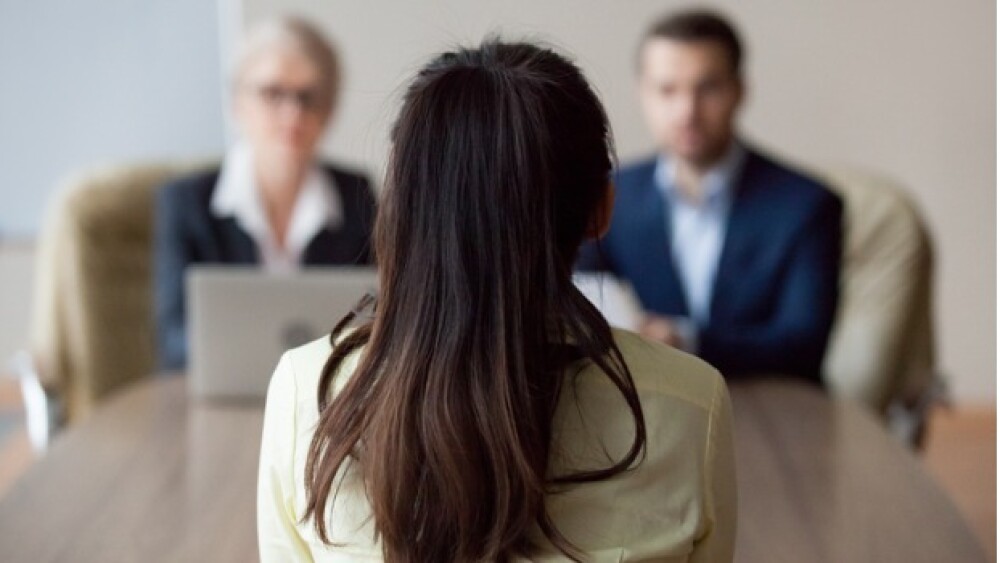 Pictured: Candidate interviewing with two professi