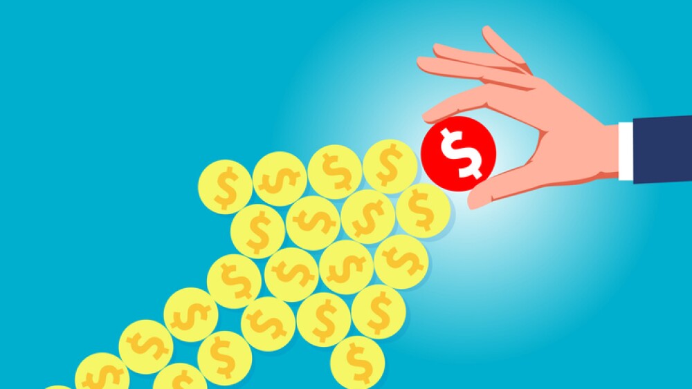 businessman holding gold coins forming a growing arrow symbol.