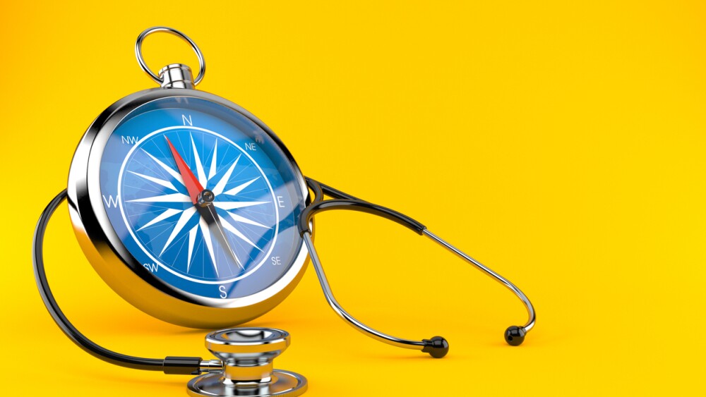 Stethoscope with compass isolated on orange background. 3d illustration
