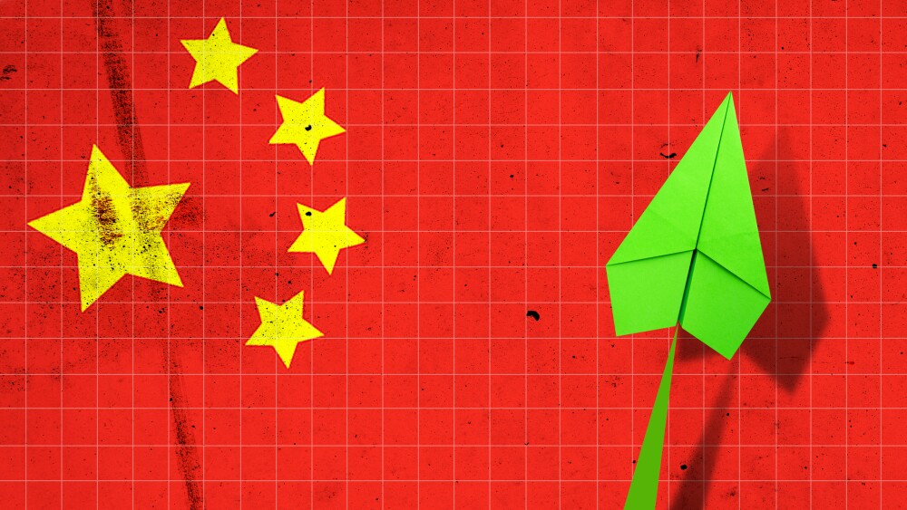 Upward arrow on the background of the flag of China. Paper plane. Economic recovery. Copy space. Business. Background.