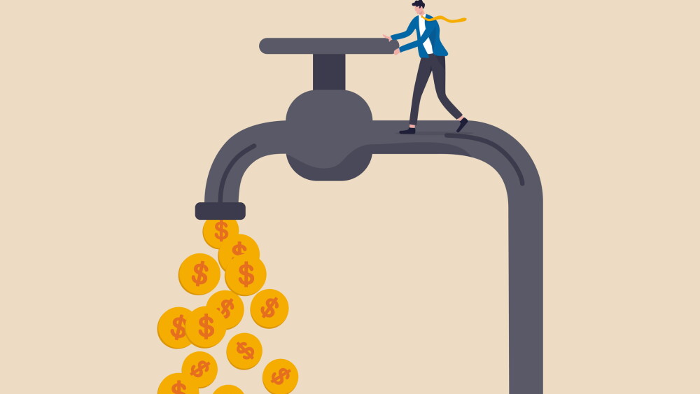 Cash flow, making profit from business or earning from stock investment concept, wealthy businessman business owner or investor opening water tap to let gold dollar coins money flowing out.