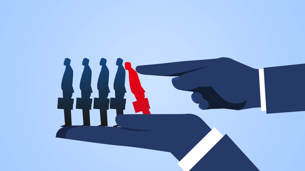 Illustration depicting layoffs with index finger overturning row of businessmen standing on big hands