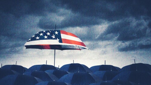 American Flag Umbrella Standing Out in the Rain Among Dark Umbrellas