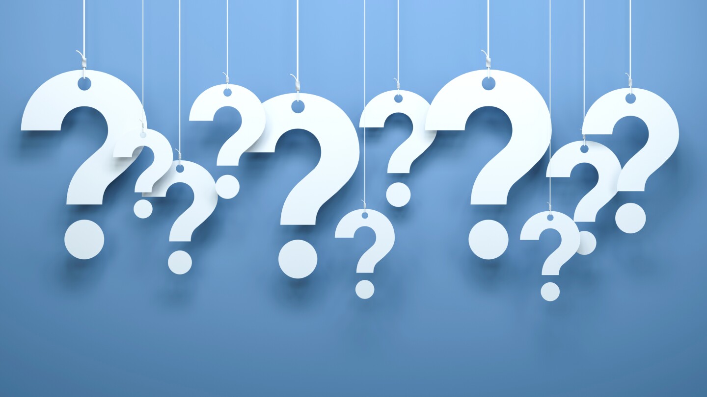 Hanging questions.Blue background.