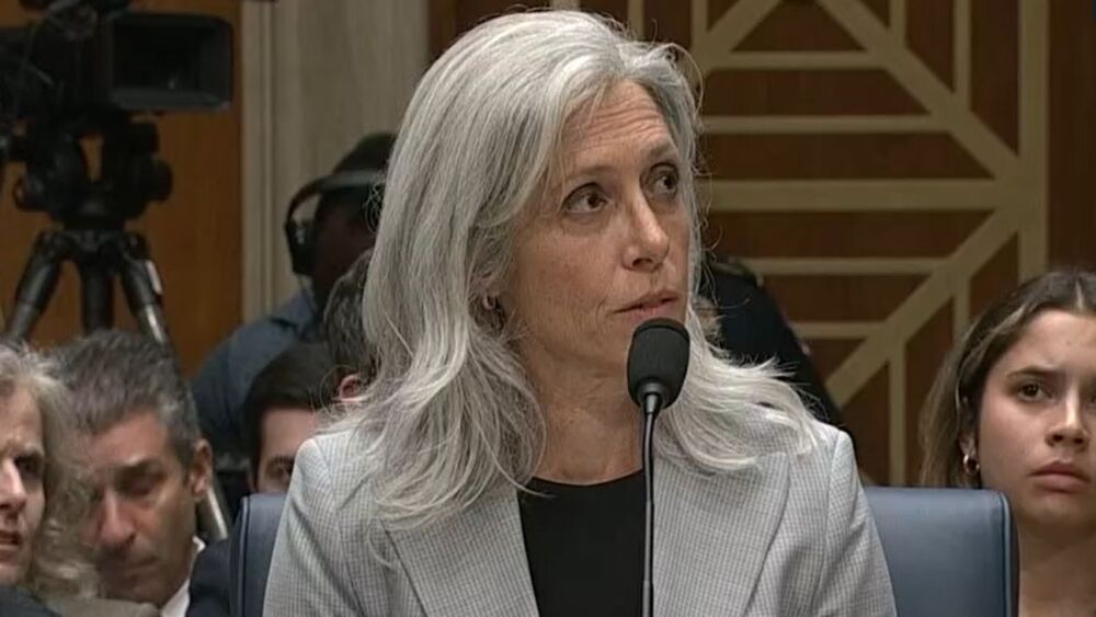 Susan Monarez speaking to a senator at her confirmation hearing as CDC director