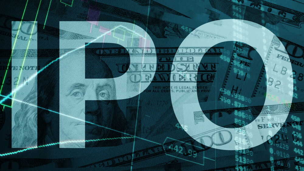 Words IPO (Initial public offering) with the trading data on the background.