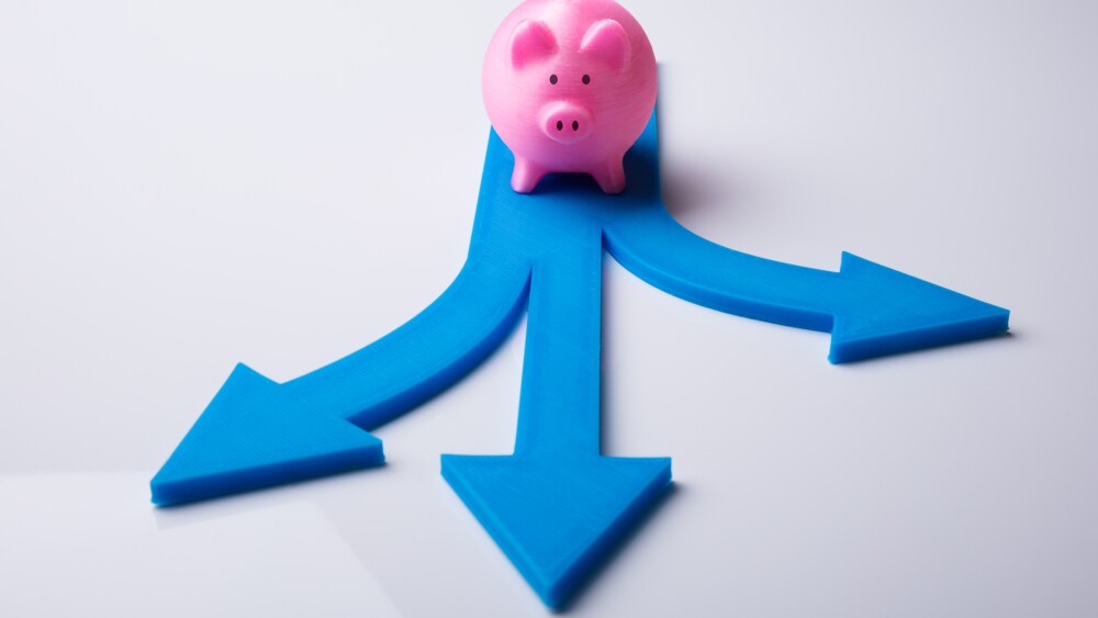 Elevated View Of Pink Piggybank And Blue Arrow Signs Showing Various Direction
