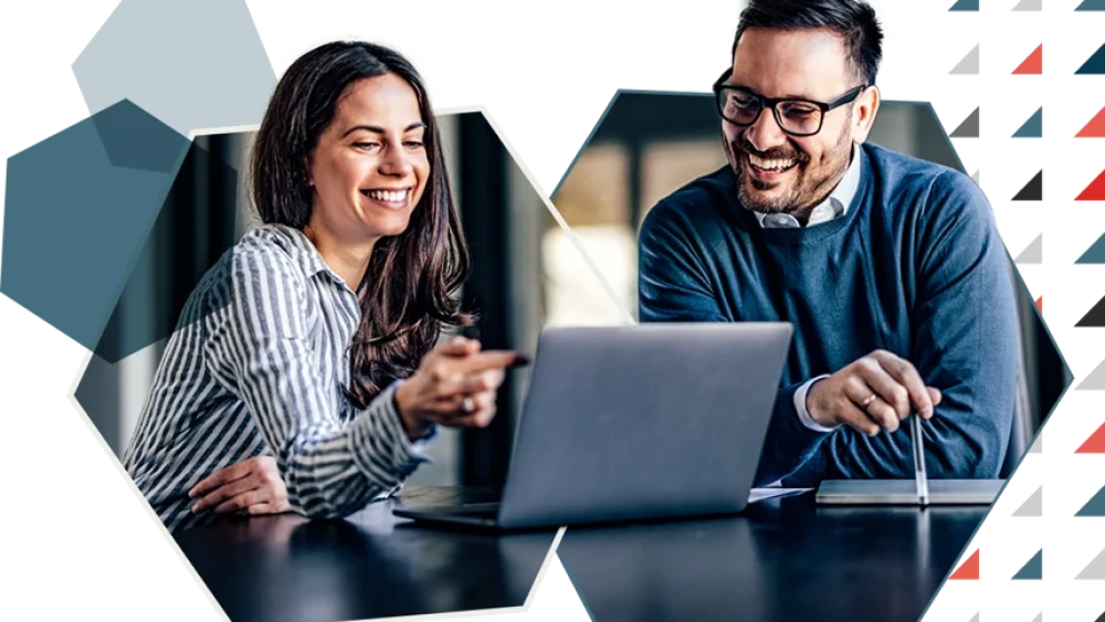 Two business people on a laptop