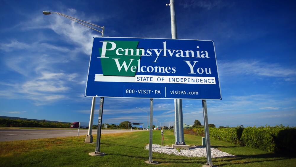 Welcome to Pennsylvania sign at the Pennsylvania/New York state line along Interstate 90.