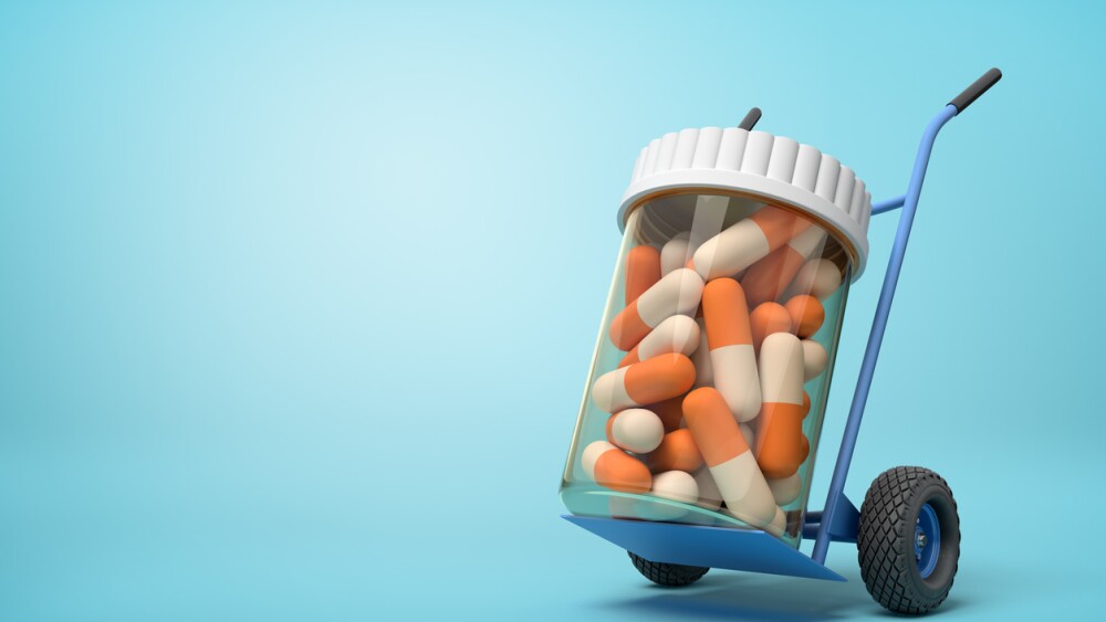 3d rendering of a plastic jar with medical pills on a hand truck on blue background. Medicine and health. Bottles and containers. Healthcare industry.