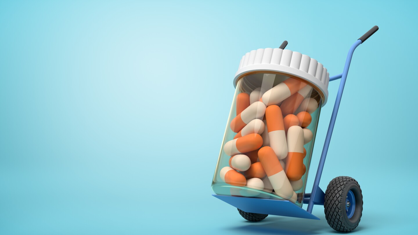 3d rendering of a plastic jar with medical pills on a hand truck on blue background. Medicine and health. Bottles and containers. Healthcare industry.