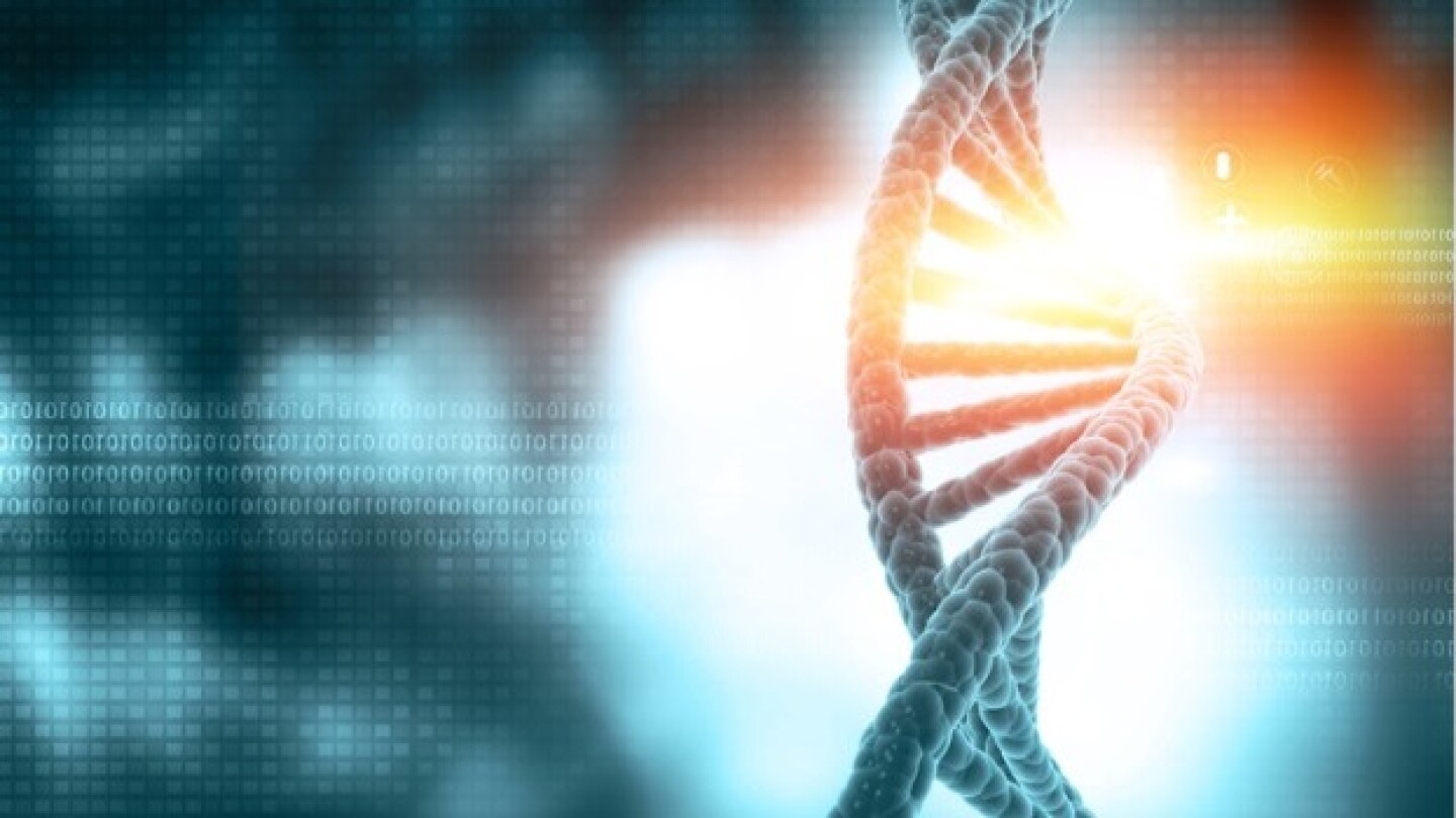 Pictured: DNA strand on background of binary code/