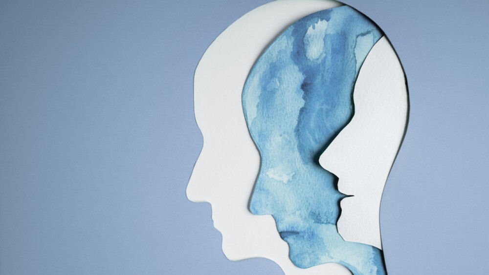 Mental Health Disorder Concept. Bipolar Disorder Person. Unstable Psycho. Layers of Paper Cut as Human Head presenting Different of Emotions. Happiness and Depression Emotion inside