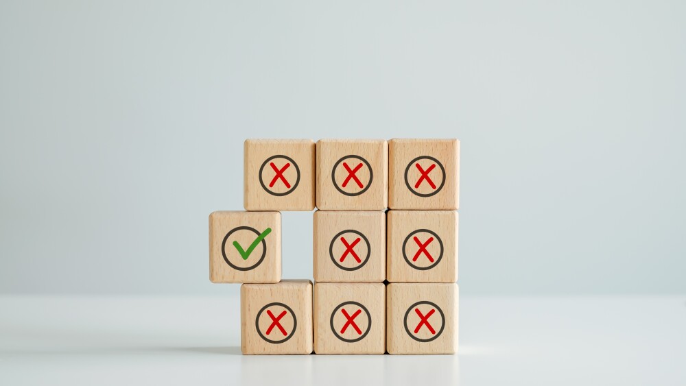 Individuality, Unique, Unswerving, Steady. Green correct check mark among many red wrong or cross icon on wooden circle for true or false changing mindset. Not changing or becoming weaker.