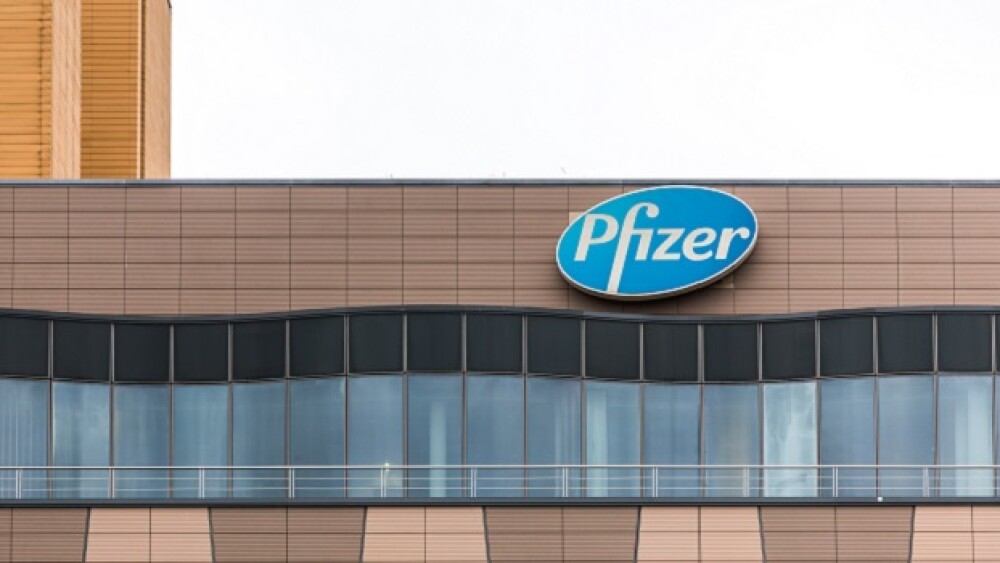 Pictured: Blue and white Pfizer sign on building/T