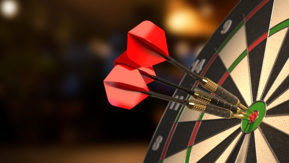 Dartboard with three darts in the bullseyes. 3D illustration