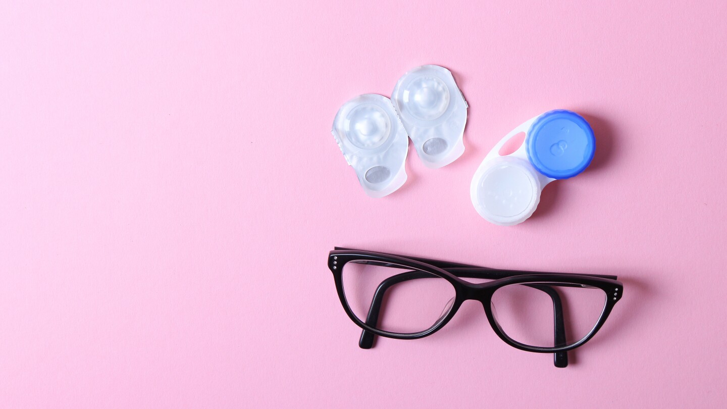 Glasses and lenses for correcting vision on a colored background. High quality photo